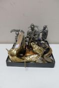 A box of two brass horse head coat hooks, pill boxes, three Royal Hampshire metal figures,