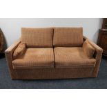 A contemporary two seater bed settee