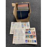 A box of thirteen stamp albums of world stamps relating to space travel, fish,