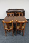 A 1930's oak sideboard together with pull out table and four chairs