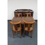 A 1930's oak sideboard together with pull out table and four chairs