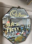 An unframed Art Deco mirror with later painted advertisement