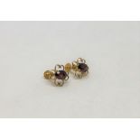 A pair of 9ct gold garnet set earrings (2)