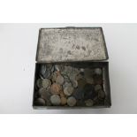 A tin of pre decimal British coins and foreign coins