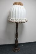 A stained beech standard lamp with mushroom shade