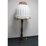 A stained beech standard lamp with mushroom shade