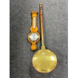 An inlaid mahogany cased barometer and a 19th century brass and copper warming pan