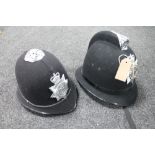 Two policeman's helmets - West Midlands and Northumbria