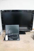 A Philips 32 inch LCD TV with remote together with a Dell laptop with lead