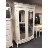 A Laura Ashley cream double mirror door wardrobe,