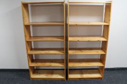 A pair of pine open bookshelves