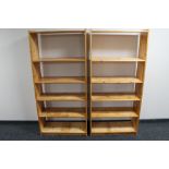 A pair of pine open bookshelves