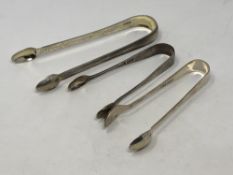 A pair of Georgian silver sugar tongs and two other silver pairs (3) CONDITION REPORT: