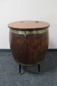 A brass mounted barrel cocktail cabinet