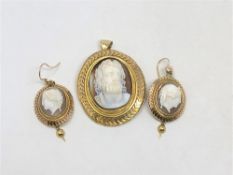 A pair of yellow gold cameo earrings with matching pendant.