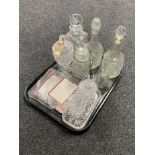 A tray of assorted glass ware, pressed glass and lead crystal, decanters,