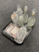 A tray of assorted glass ware, pressed glass and lead crystal, decanters,