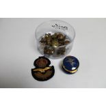 A box of militaria badges, buttons, sew on patch,