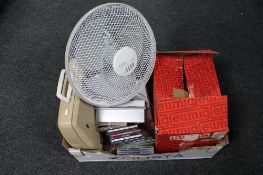 A box of electric fan, CD's, typewriter, reel projector,