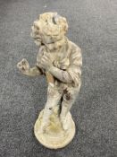 An antique lead figure of a boy