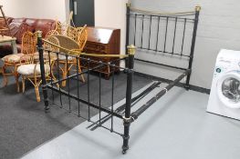 An antique brass and painted metal bed frame