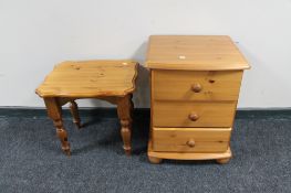 A pine three drawer chest and a lamp table
