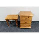 A pine three drawer chest and a lamp table