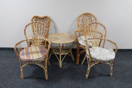 Five pieces of cane and wicker furniture - four chairs and an occasional table