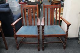 A pair of early twentieth century oak carver armchairs