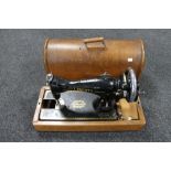 A vintage Liberty sewing machine in case