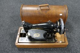 A vintage Liberty sewing machine in case
