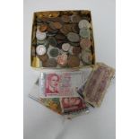 A box of 20th century pre decimal coins and small quantity of foreign bank notes