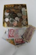 A box of 20th century pre decimal coins and small quantity of foreign bank notes