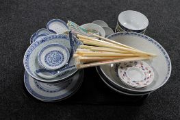 A tray of Chinese rice bowls, spoons,