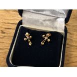 A pair of yellow gold diamond set cross earrings.