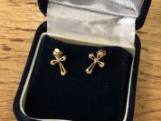 A pair of yellow gold diamond set cross earrings.