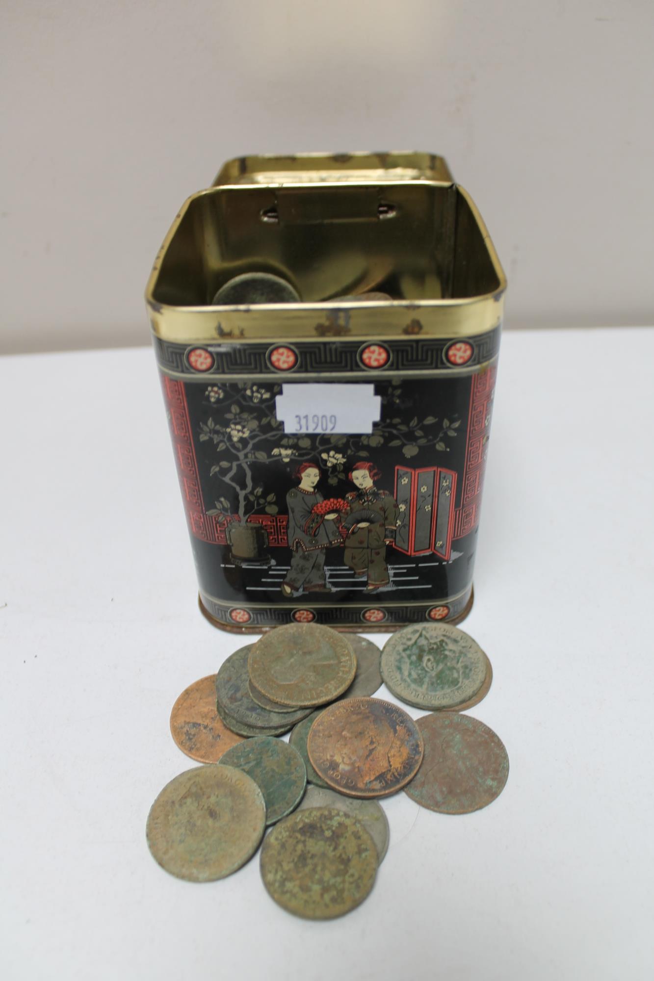 A metal tin of pre decimal British coins and foreign coins