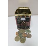 A metal tin of pre decimal British coins and foreign coins