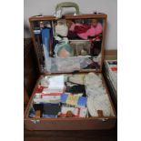 A mid 20th century Cheney case of haberdashery items
