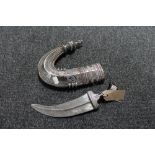 An early 20th century Eastern white metal mounted jambiya dagger in sheath CONDITION