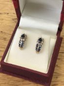 A pair of yellow gold diamond and sapphire earrings