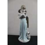 A Lladro figure - girl with kitten