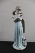 A Lladro figure - girl with kitten