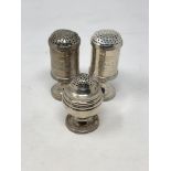 Three Georgian silver salt and pepper sifters,
