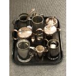 A tray of silver plated items, pewter tankards, napkin rings etc.