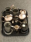 A tray of silver plated items, pewter tankards, napkin rings etc.