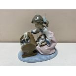 A Lladro figure - girl with cat and kittens