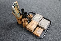 A tray of carved ebony and hardwood elephant, hand fans,