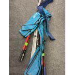 A collection of fishing rods and items to include 14' beachcaster with rod bag,