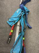 A collection of fishing rods and items to include 14' beachcaster with rod bag,